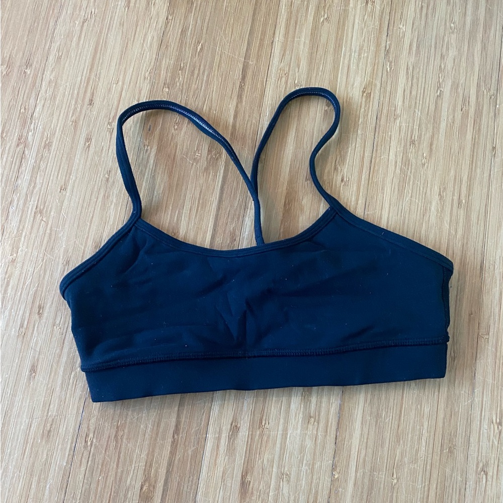 Women’s Lululemon, black strappy sports bra. Size 4. Good condition.